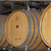A row of wooden wine barrels.